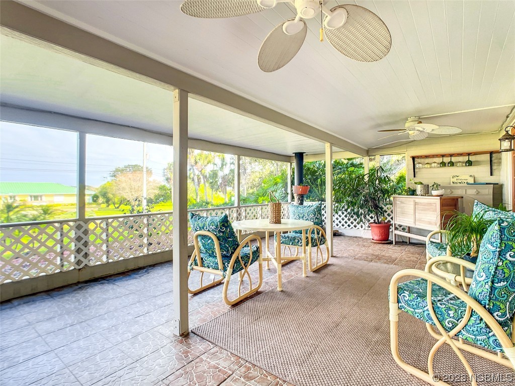 418 North Riverside Drive Edgewater, FL 32132 - Photo 10 of 48 a living room with furniture and a large window