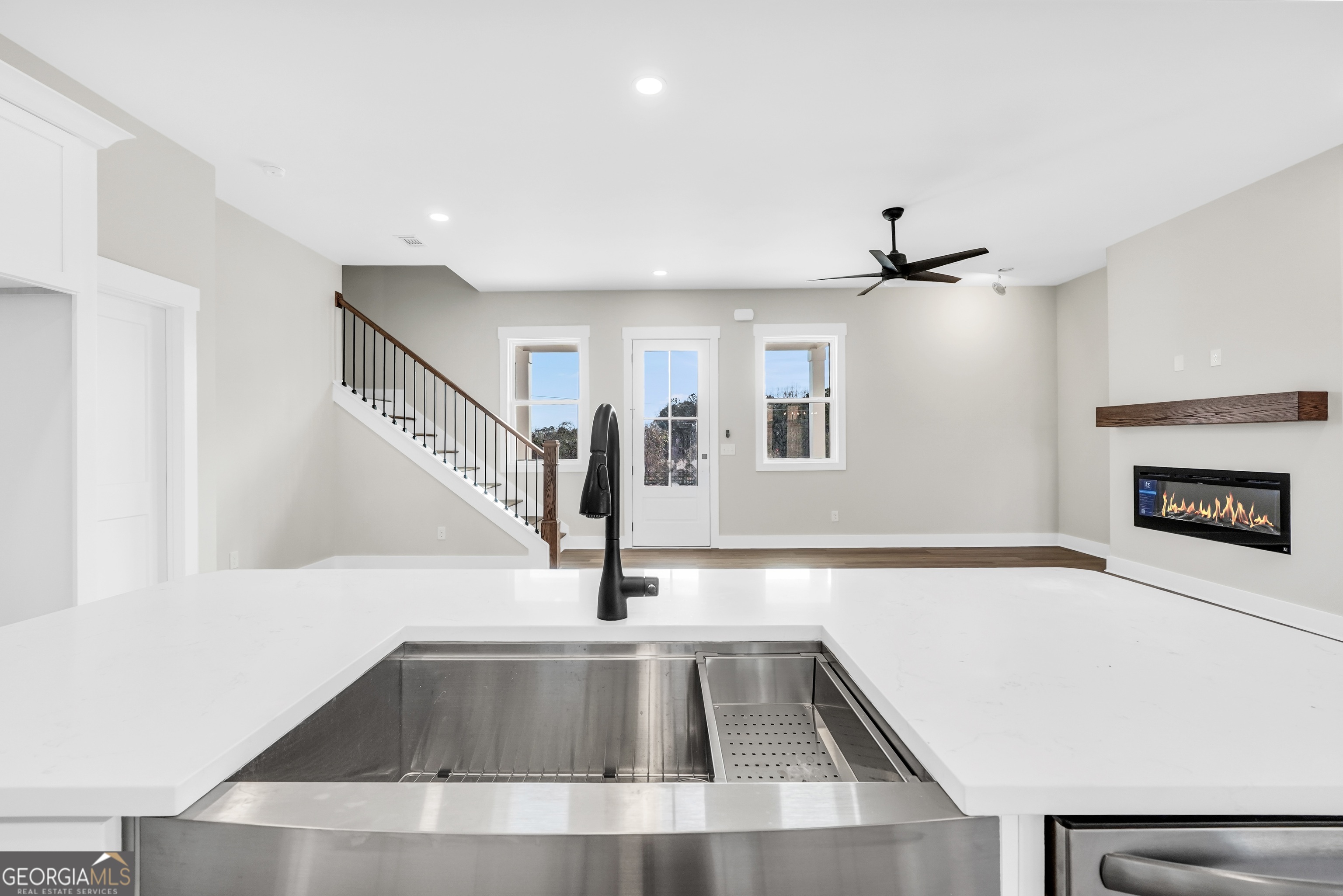 297 East Knight Road McDonough, GA 30252 - Photo 12 of 64 a view of a kitchen with a sink and a fireplace