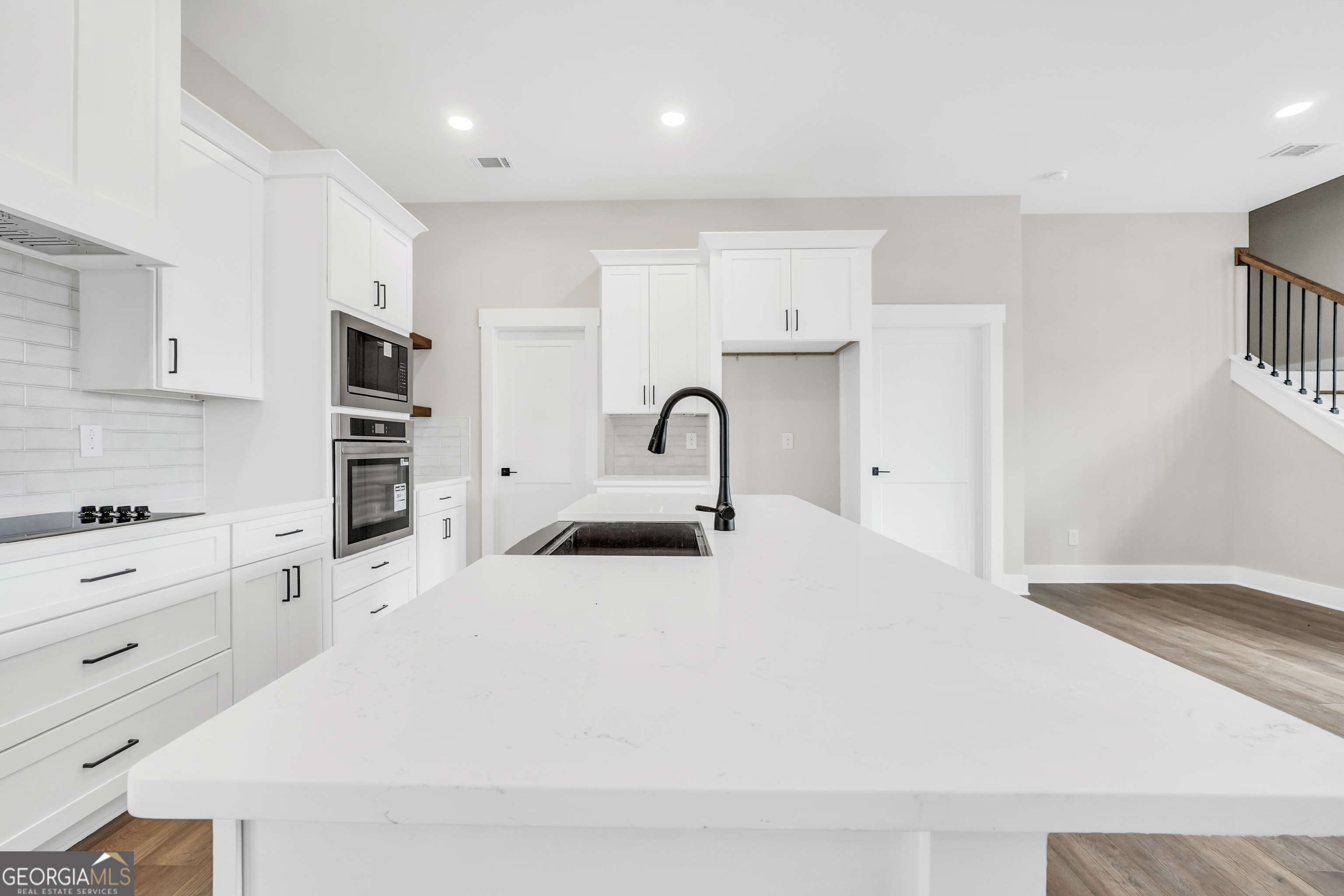 297 East Knight Road McDonough, GA 30252 - Photo 14 of 64 a large white kitchen with stainless steel appliances