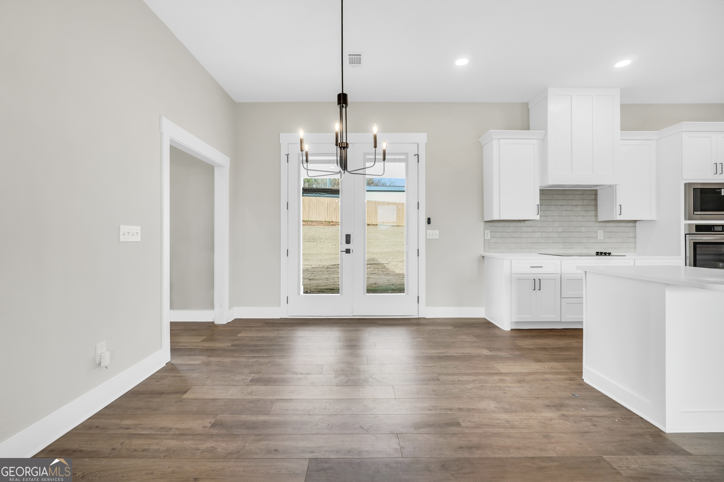 297 East Knight Road McDonough, GA 30252 - Photo 24 of 64 a kitchen with stainless steel appliances granite countertop a refrigerator and a stove top oven