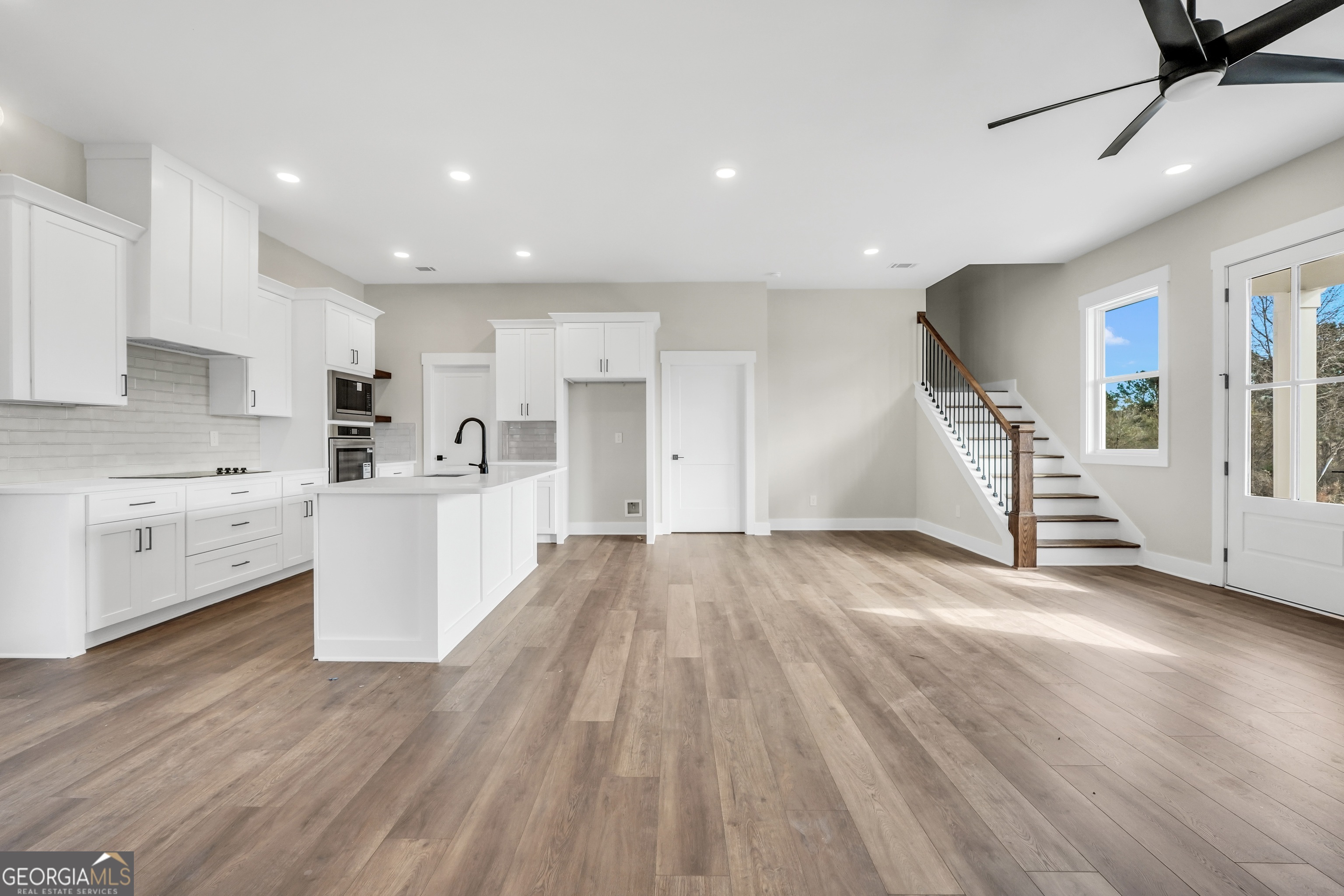 297 East Knight Road McDonough, GA 30252 - Photo 25 of 64 a view of a kitchen with wooden floor and electronic appliances