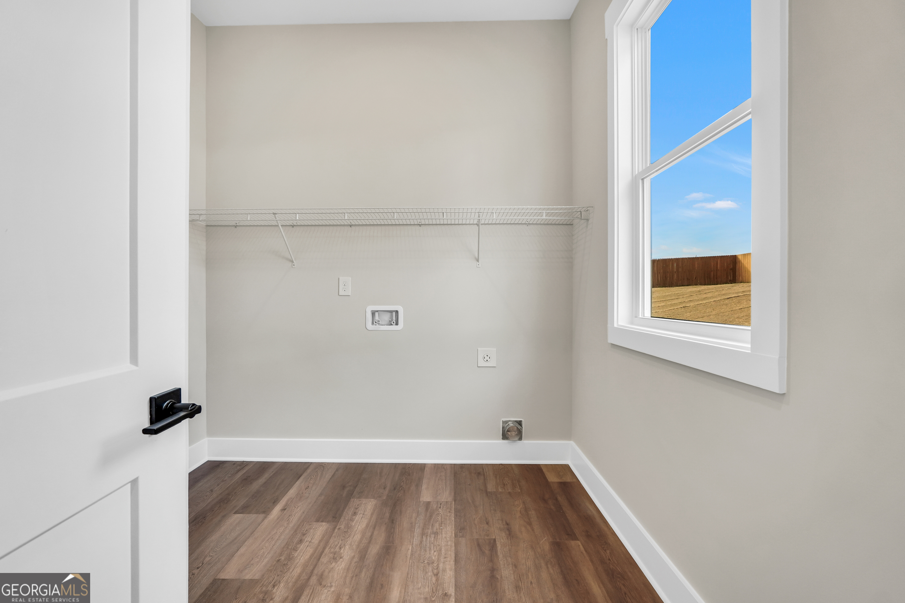 297 East Knight Road McDonough, GA 30252 - Photo 28 of 64 a view of a room that has a window and wooden floor