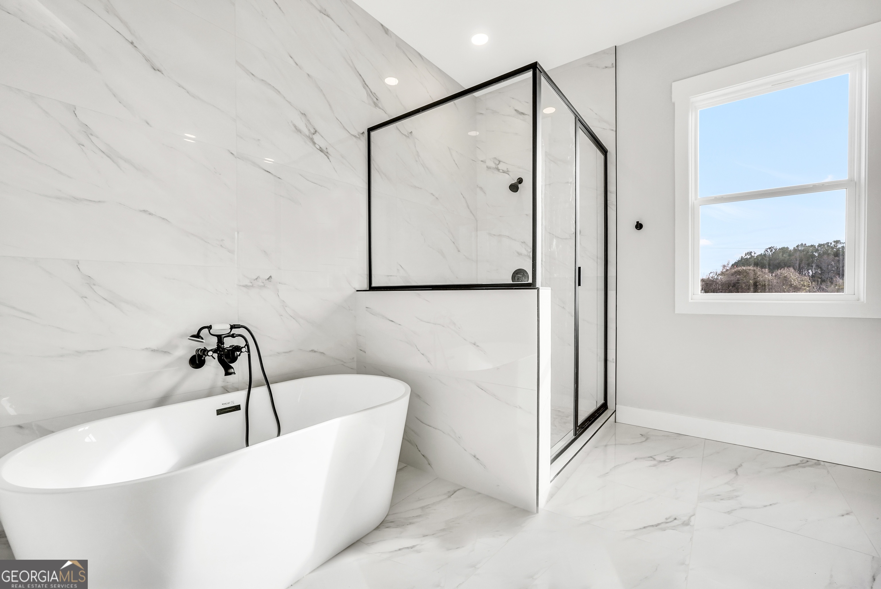 297 East Knight Road McDonough, GA 30252 - Photo 30 of 64 a bathroom with a bathtub and shower