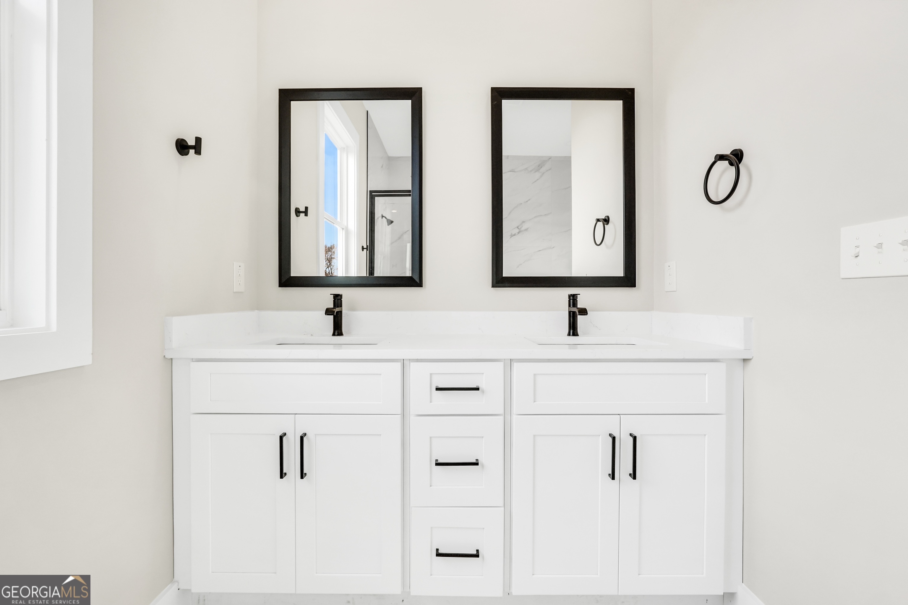 297 East Knight Road McDonough, GA 30252 - Photo 35 of 64 a bathroom with double sink and a mirror