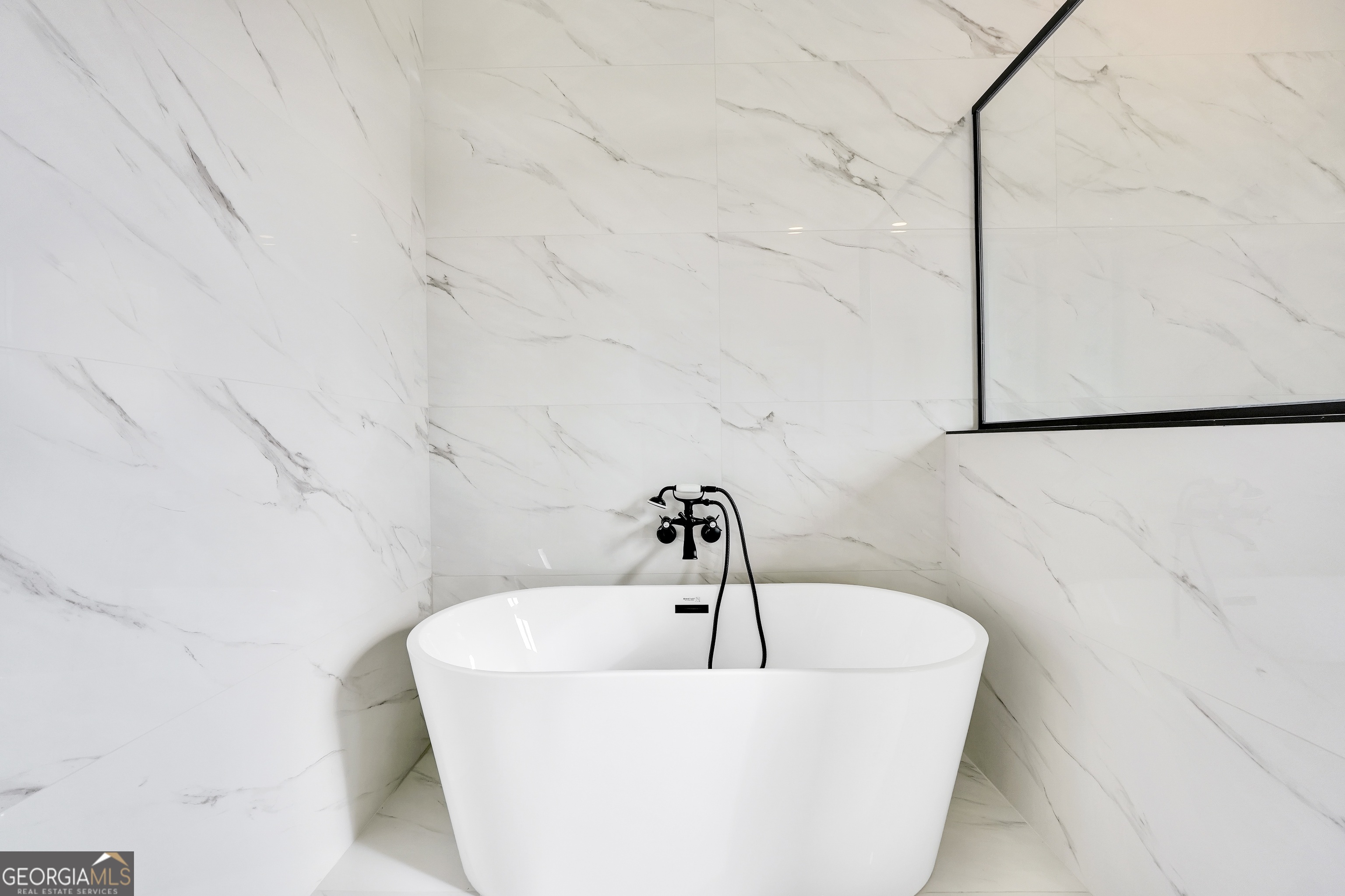 297 East Knight Road McDonough, GA 30252 - Photo 37 of 64 a white bath tub sitting in a bathroom