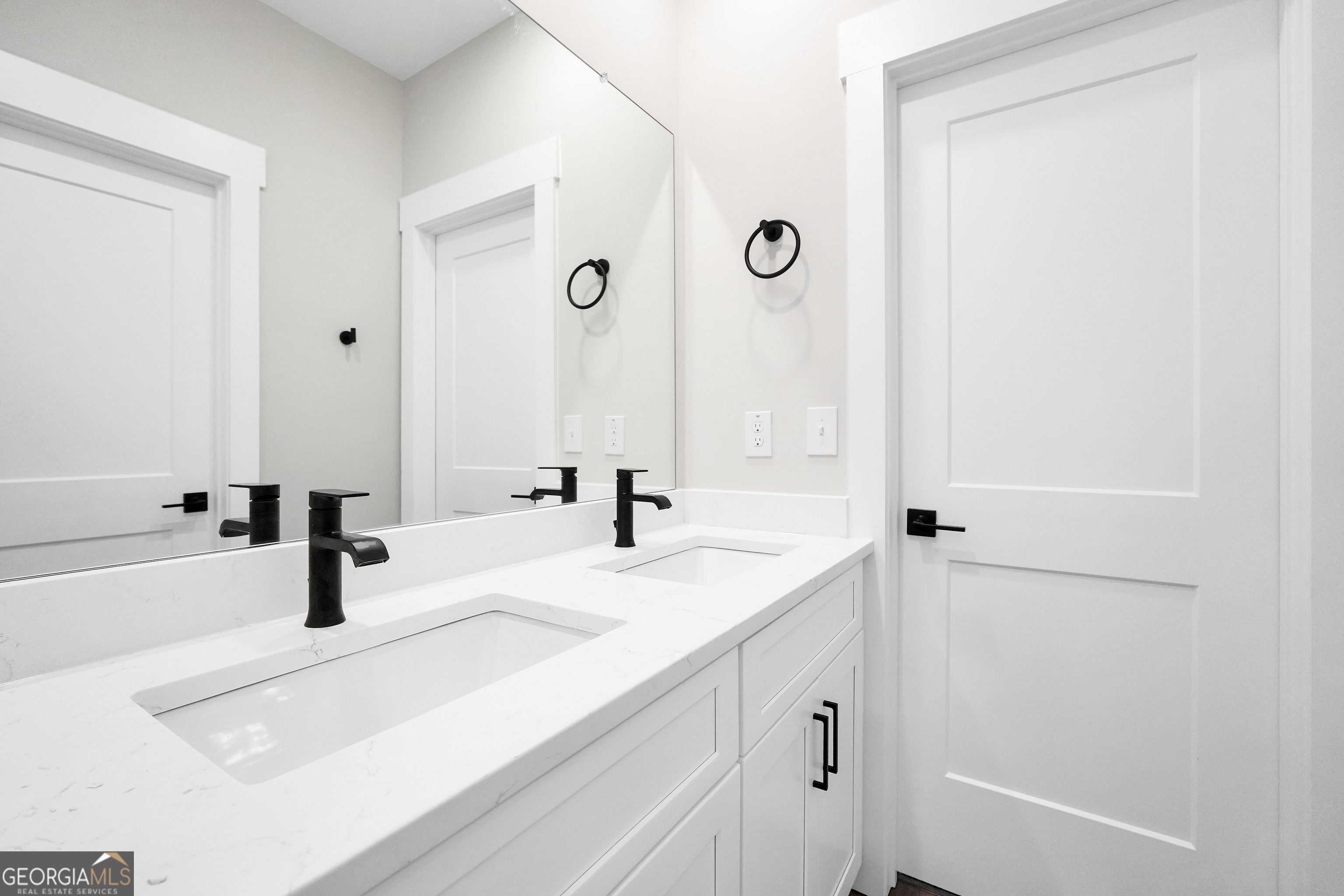 297 East Knight Road McDonough, GA 30252 - Photo 46 of 64 a bathroom with a sink and a mirror