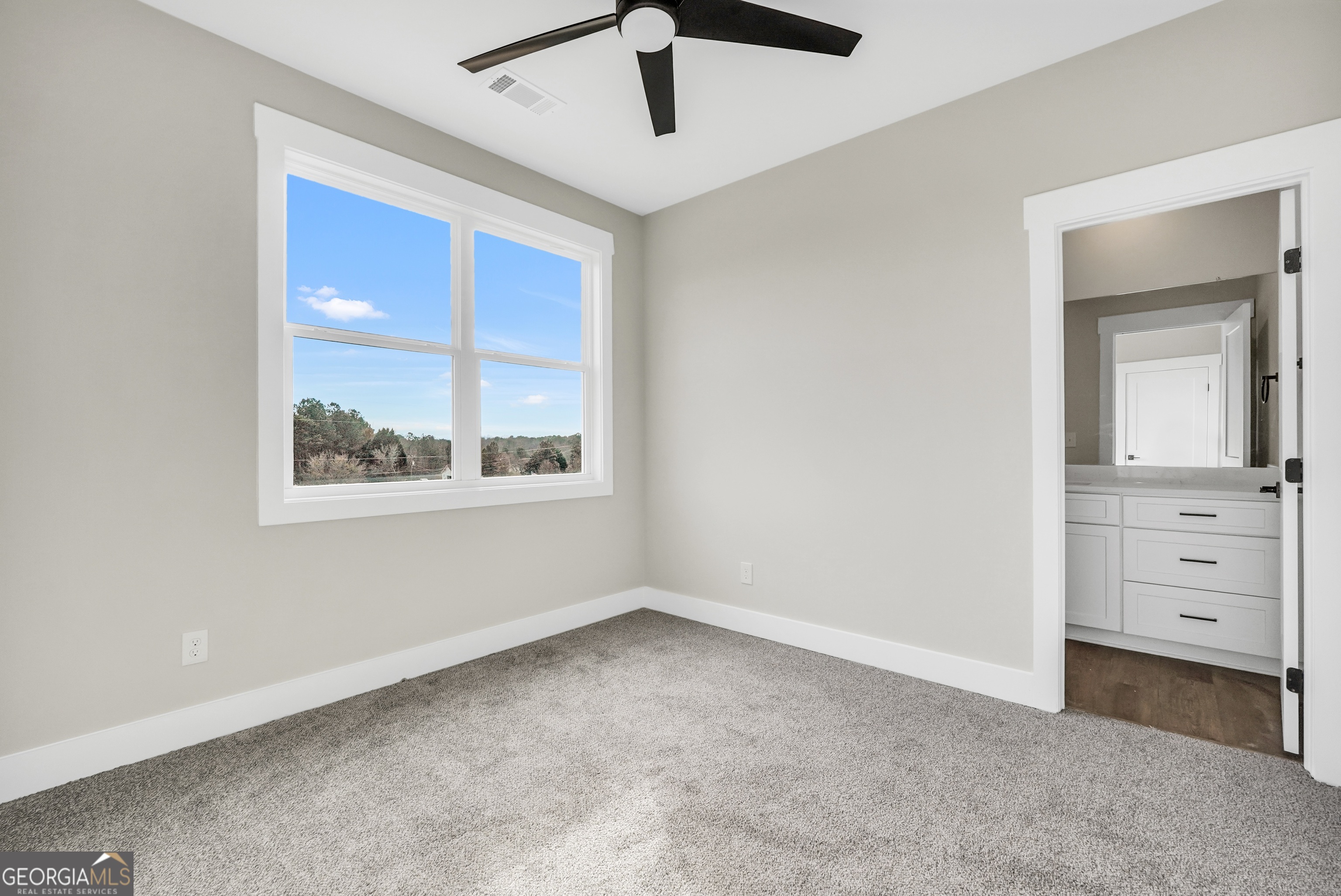 297 East Knight Road McDonough, GA 30252 - Photo 50 of 64 a view of an empty room with a window