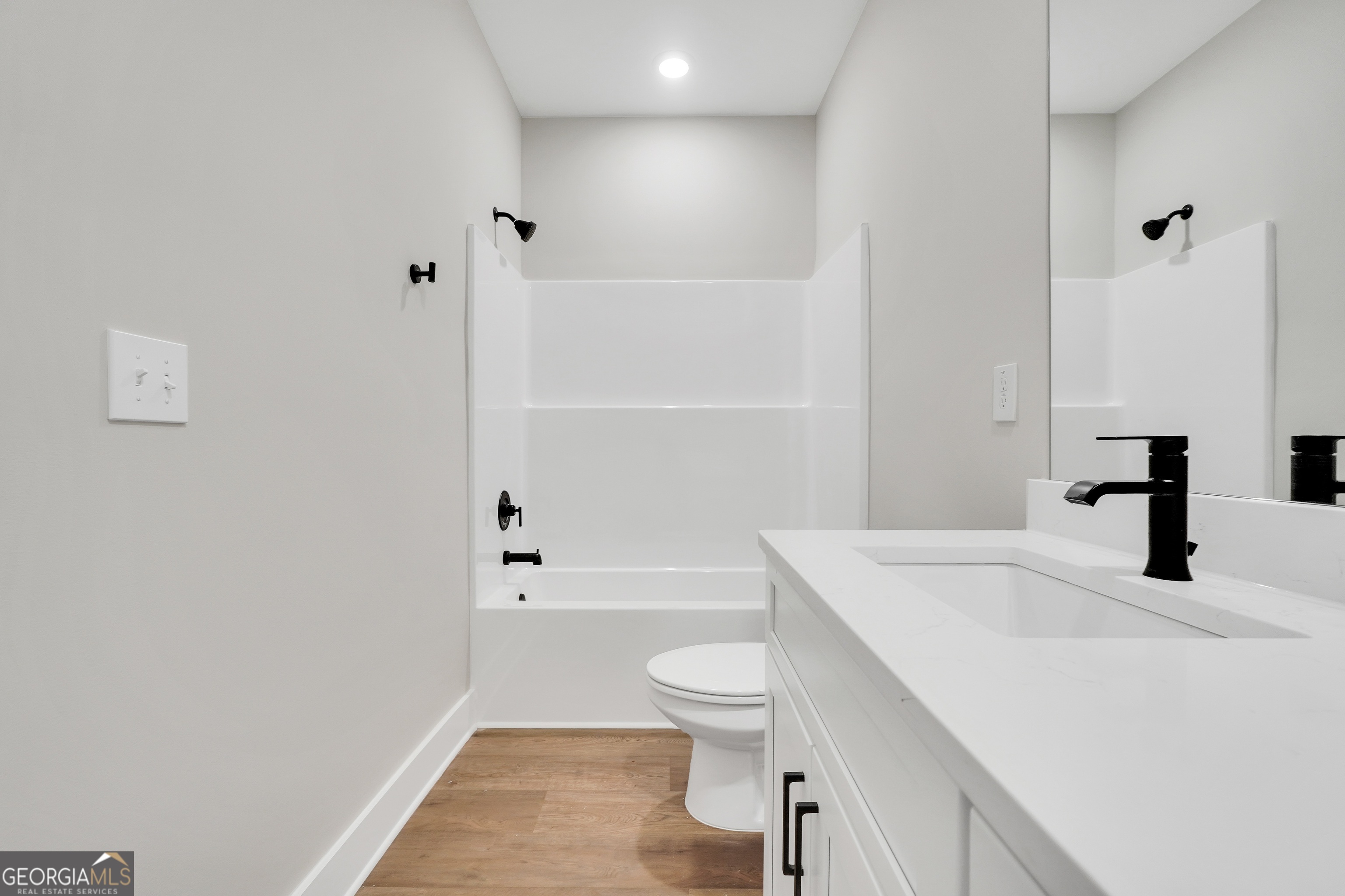 297 East Knight Road McDonough, GA 30252 - Photo 53 of 64 a bathroom with a sink a toilet and shower