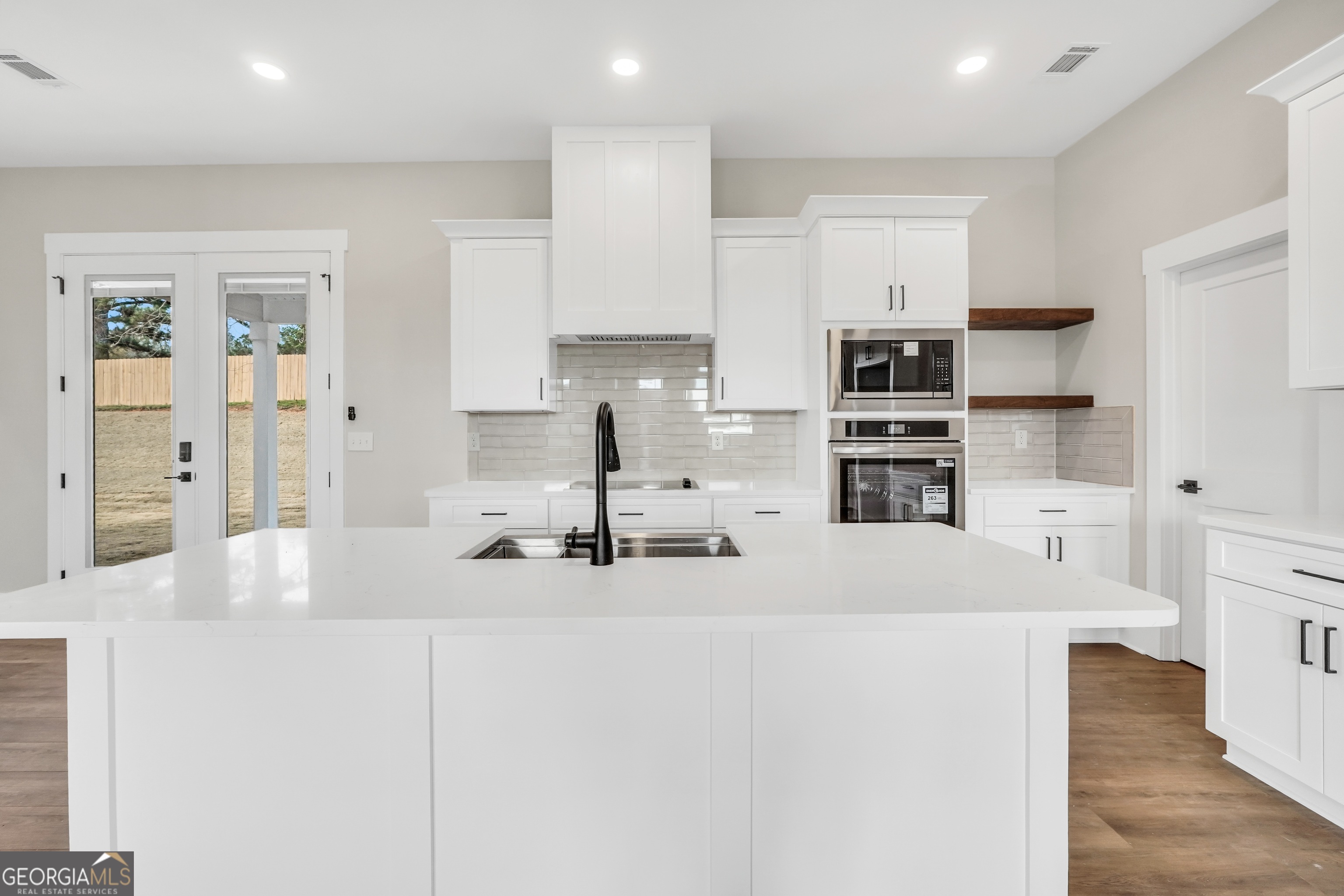 297 East Knight Road McDonough, GA 30252 - Photo 10 of 64 a kitchen with stainless steel appliances a refrigerator and a sink