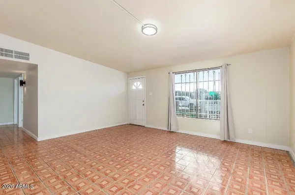 a view of an empty room with a window