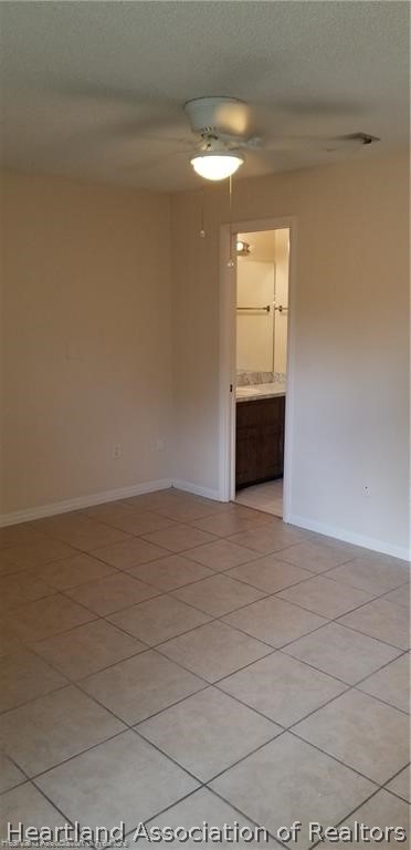 4203 Viscaya Street Sebring, FL 33872 - Photo 19 of 21 a view of an empty room with wooden floor and a window