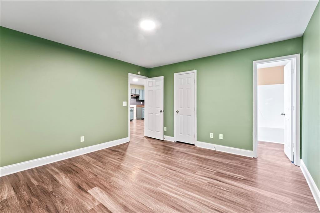 930 Hall Street Northwest, Unit A Atlanta, GA 30318 - Photo 25 of 31 a view of an empty room with wooden floor