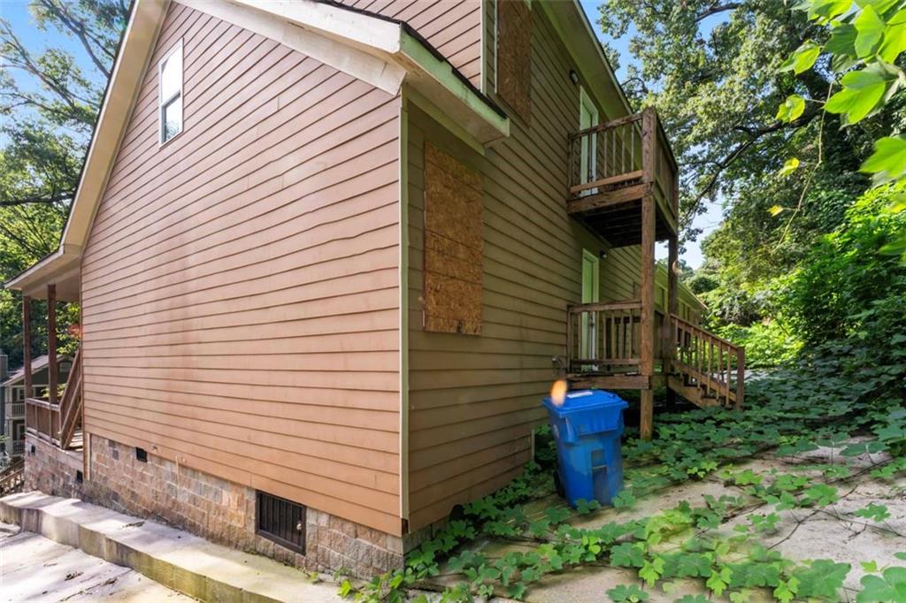 930 Hall Street Northwest, Unit A Atlanta, GA 30318 - Photo 3 of 31 a view of a patio with table and chairs and potted plants