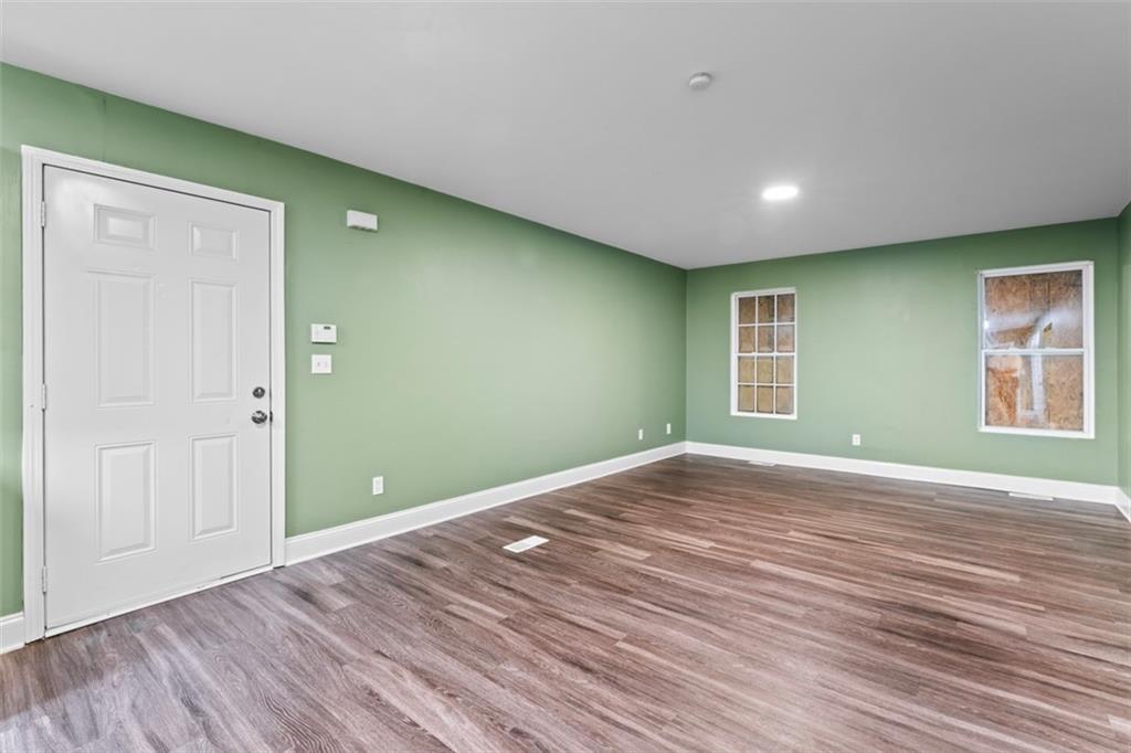 930 Hall Street Northwest, Unit A Atlanta, GA 30318 - Photo 6 of 31 a view of empty room with wooden floor and fan