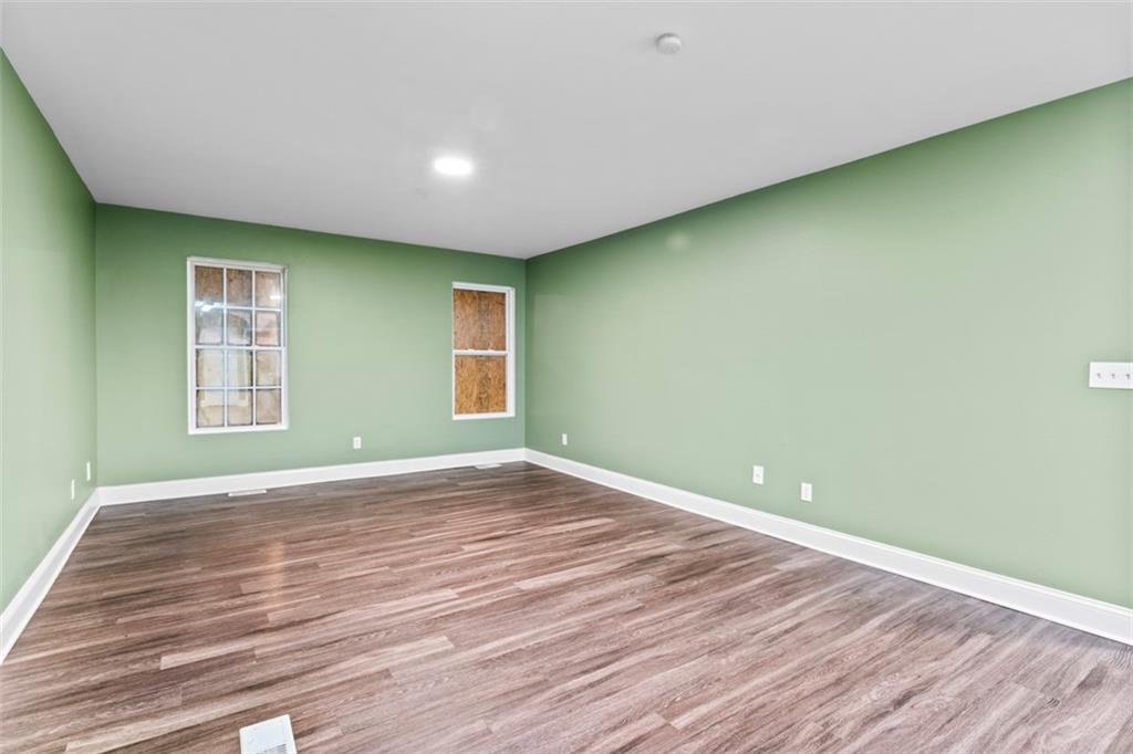 930 Hall Street Northwest, Unit A Atlanta, GA 30318 - Photo 7 of 31 a view of empty room with wooden floor and fan