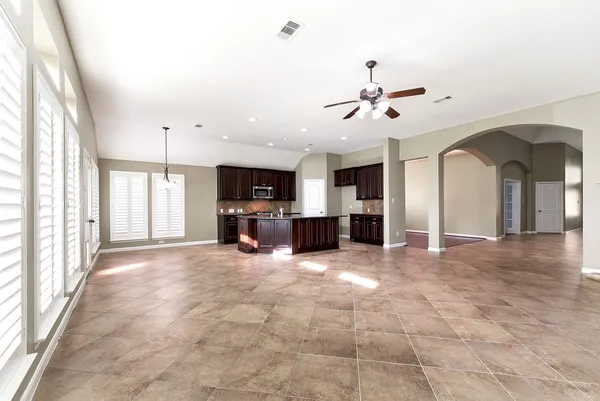 a view of a kitchen with a sink and a fireplace