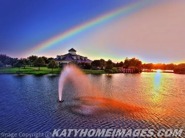 an aerial view of lake residential houses with outdoor space and ocean view