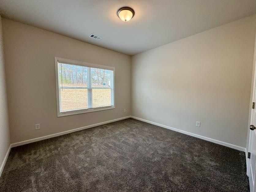 239 Cool Springs Road, Unit 8 Clarkesville, GA 30523 - Photo 17 of 37 an empty room with a window