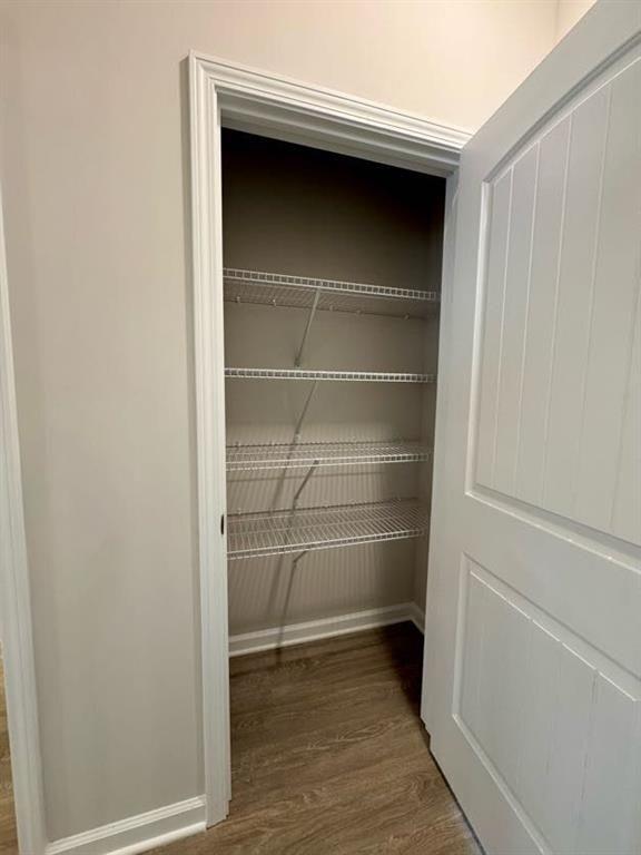 239 Cool Springs Road, Unit 8 Clarkesville, GA 30523 - Photo 21 of 37 a view of walk in closet with empty racks