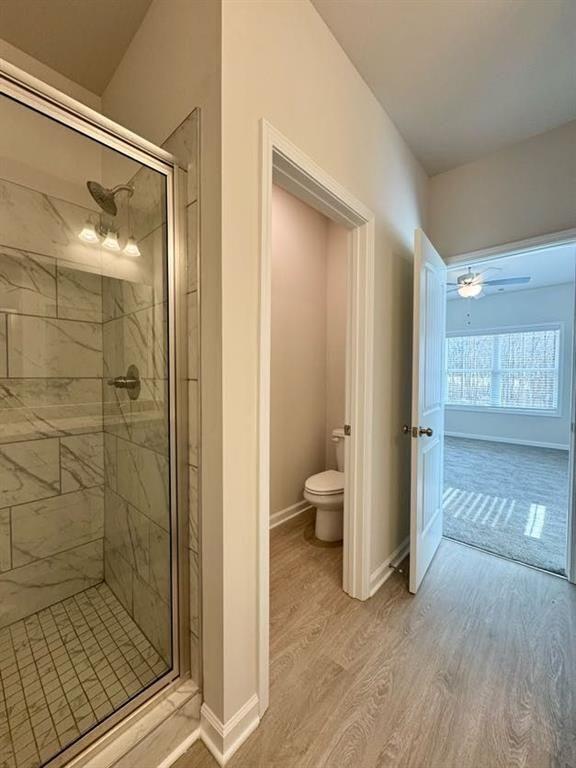 239 Cool Springs Road, Unit 8 Clarkesville, GA 30523 - Photo 27 of 37 a bathroom with a shower and a toilet