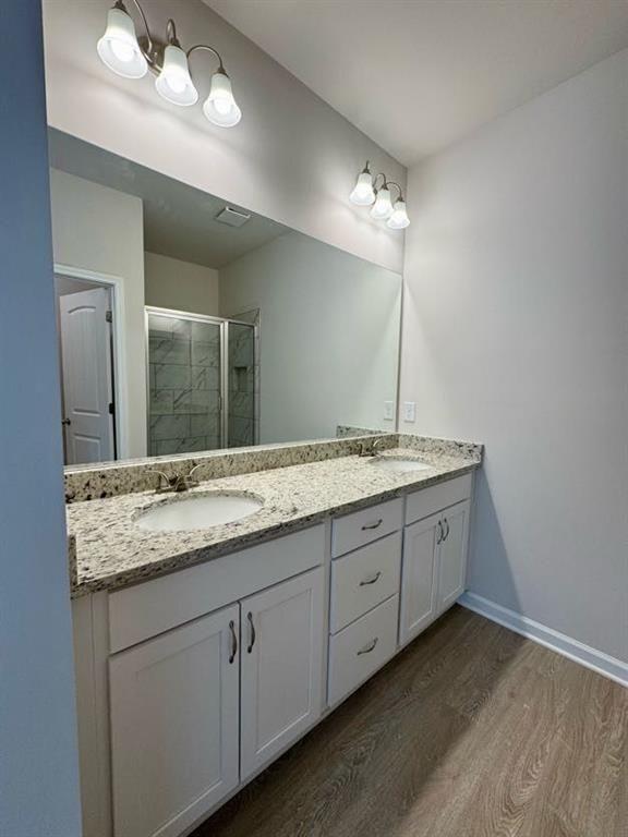 239 Cool Springs Road, Unit 8 Clarkesville, GA 30523 - Photo 29 of 37 a bathroom with double vanity sink a vanity and a large mirror