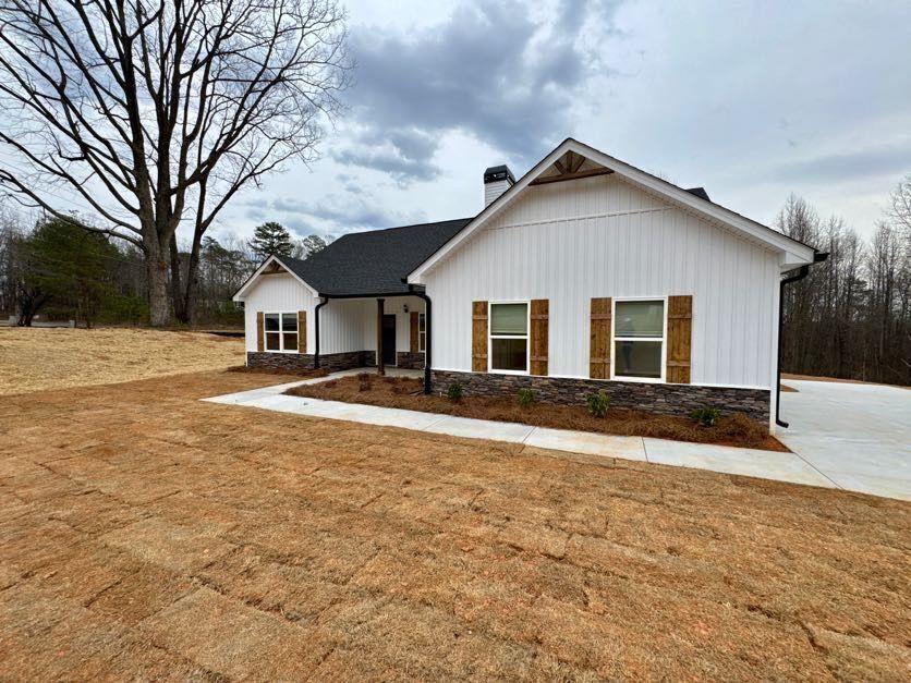 239 Cool Springs Road, Unit 8 Clarkesville, GA 30523 - Photo 4 of 37 a view of a yard in front of a house with large trees