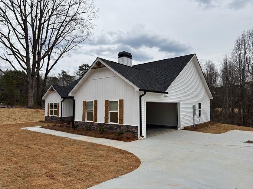 239 Cool Springs Road, Unit 8 Clarkesville, GA 30523 - Photo 7 of 37 a front view of house with yard and trees in the background