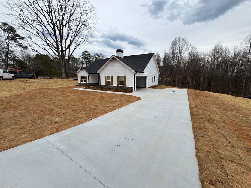 239 Cool Springs Road, Unit 8 Clarkesville, GA 30523 - Photo 9 of 37 a view of a house with a yard covered in snow