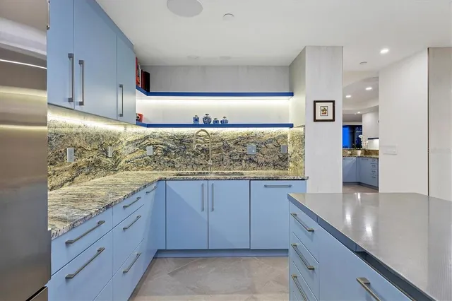 a dining room with furniture and a flat screen tv