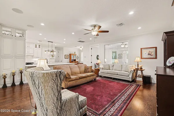 a large white kitchen with cabinets