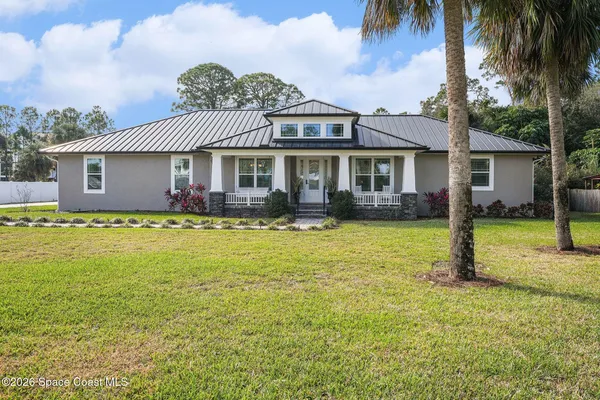 a view of a balcony with chairs