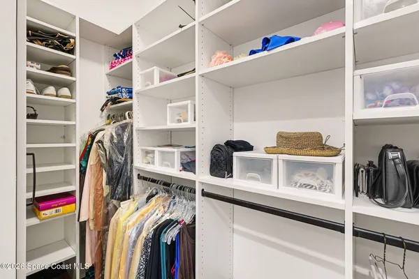 a view of an entryway with rack and bicycle