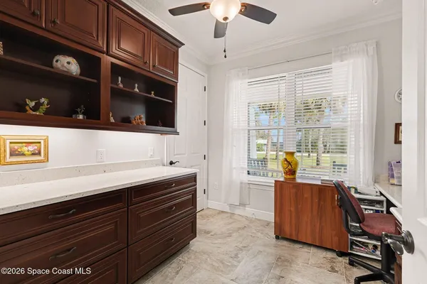 an aerial view of residential houses with outdoor space and swimming pool