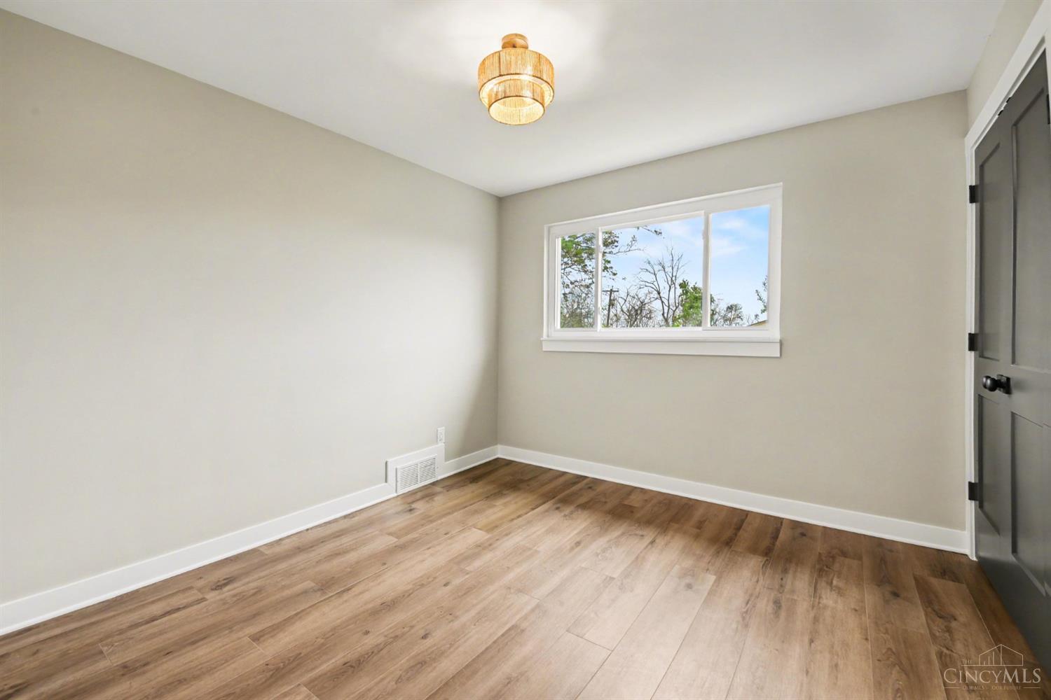 7230 Barret Road West Chester, OH 45069 - Photo 19 of 50 Middle Bedroom. Simple yet ample. Offering hemp semi flush chandelier and double door, double panel, deep closets.