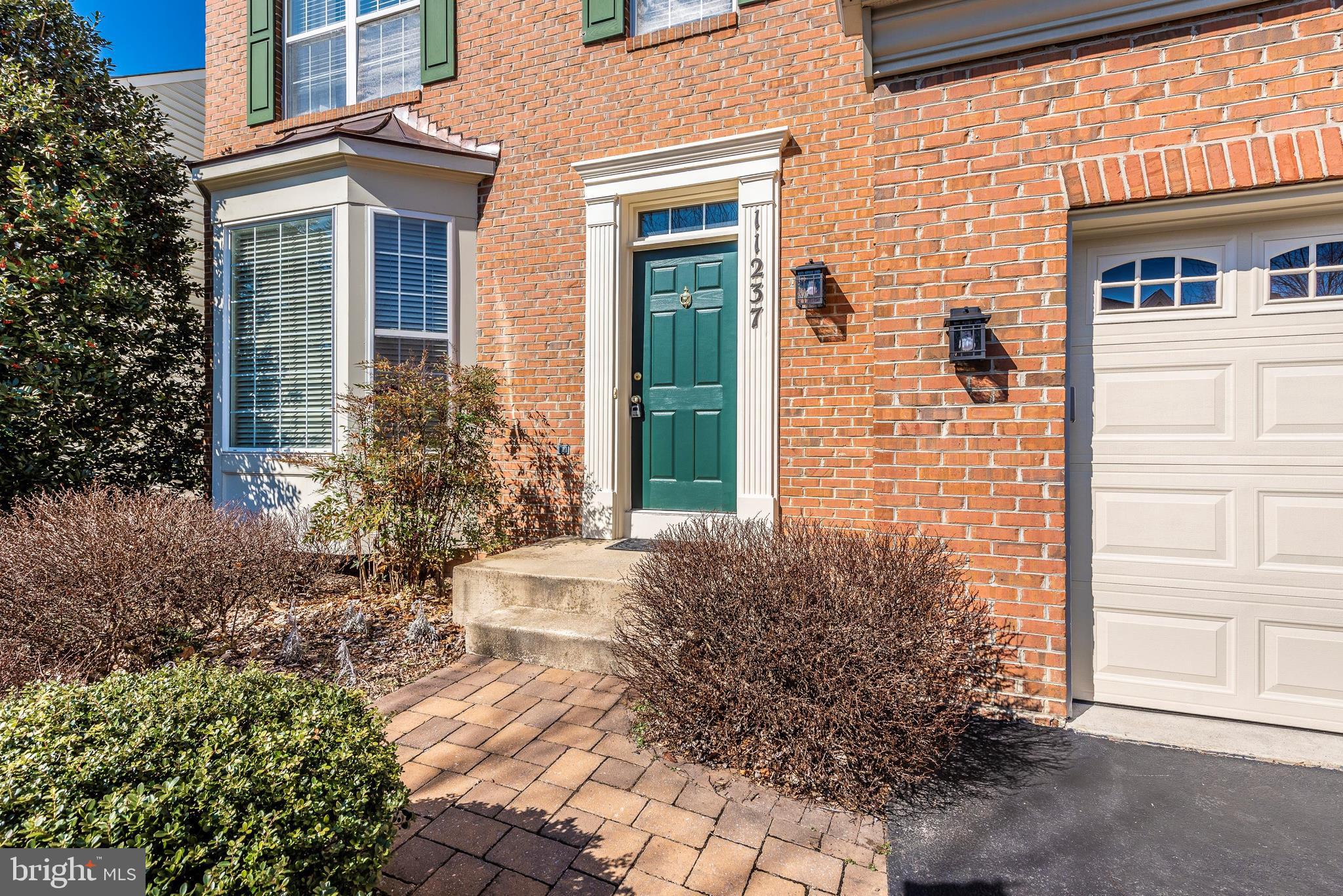 Nicely Landscaped with Paver Walkway