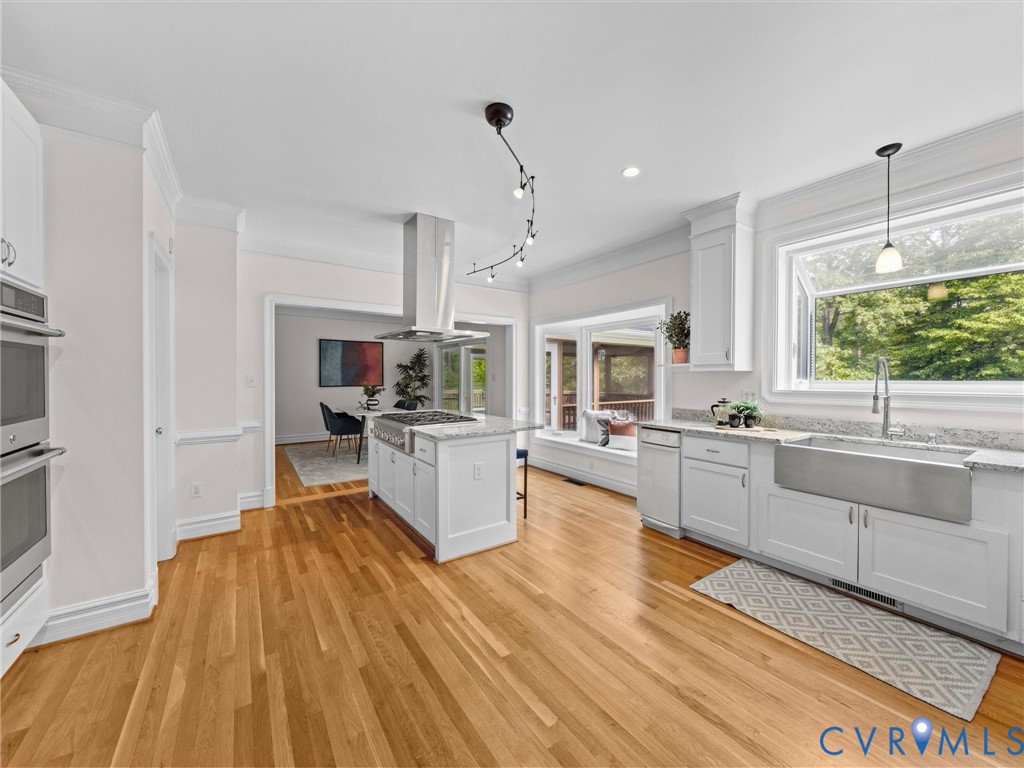 1700 Tigers Road Manakin-Sabot, VA 23103 - Photo 17 of 64 a large white kitchen with wooden floors and white appliances