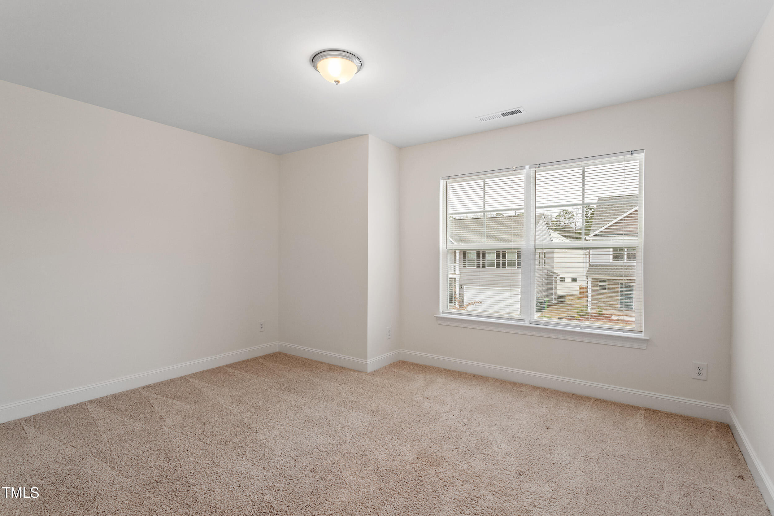 3504 Triad Court Raleigh, NC 27604 - Photo 27 of 34 an empty room with a window