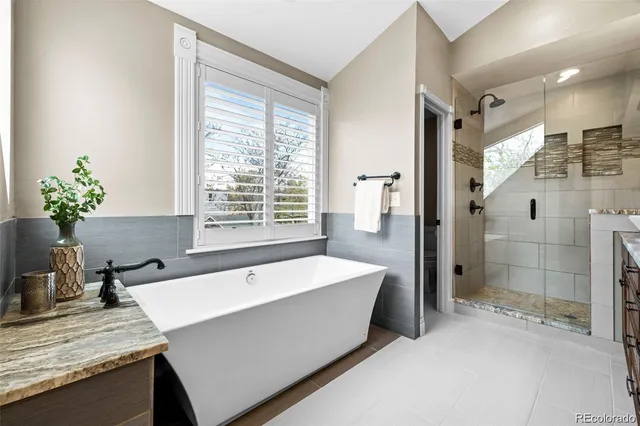 a spacious bathroom with sink and shower