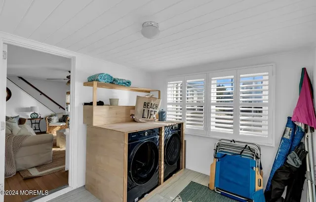 a view of a kitchen with washer and dryer