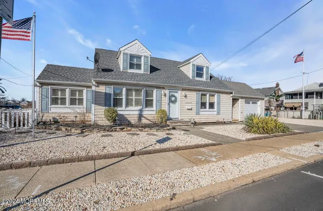 a front view of a house with yard