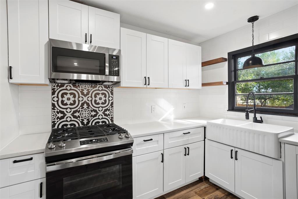 611 East Watkins Street Tyler, TX 75701 - Photo 13 of 29 a kitchen with white cabinets and appliances