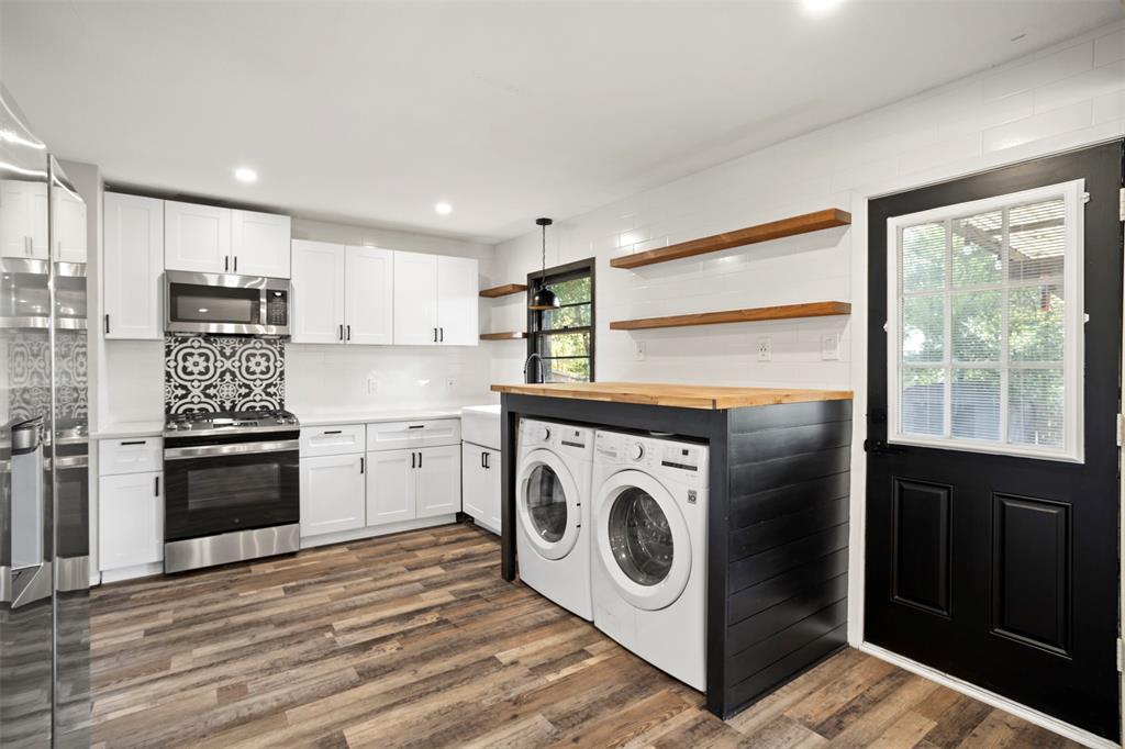 611 East Watkins Street Tyler, TX 75701 - Photo 14 of 29 a kitchen with a stove top oven and refrigerator