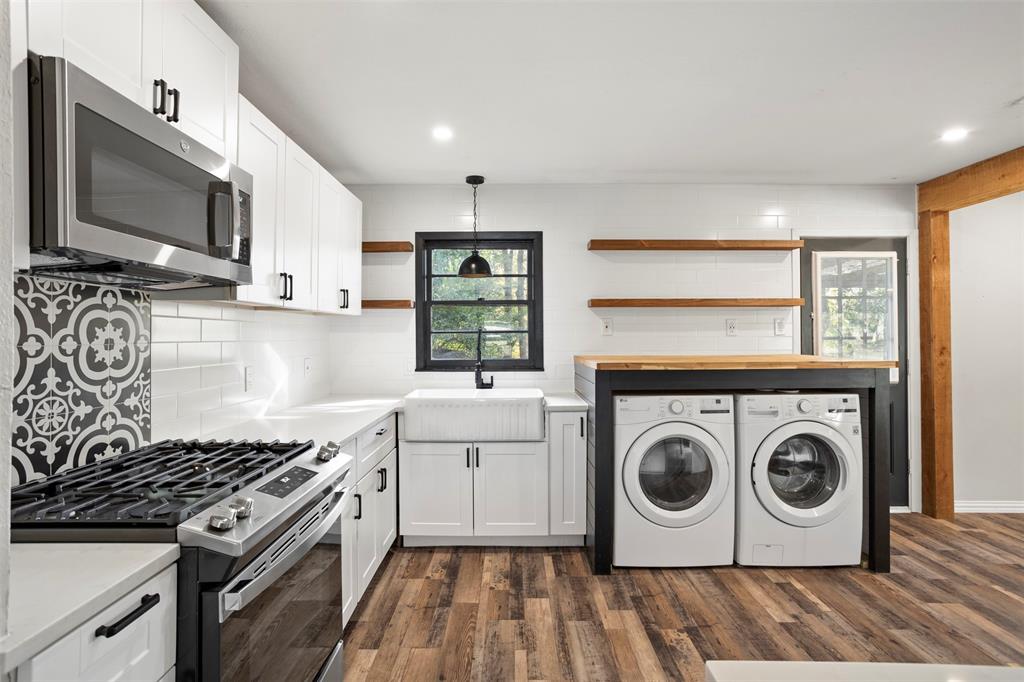611 East Watkins Street Tyler, TX 75701 - Photo 15 of 29 a kitchen with a stove top oven sink and cabinets