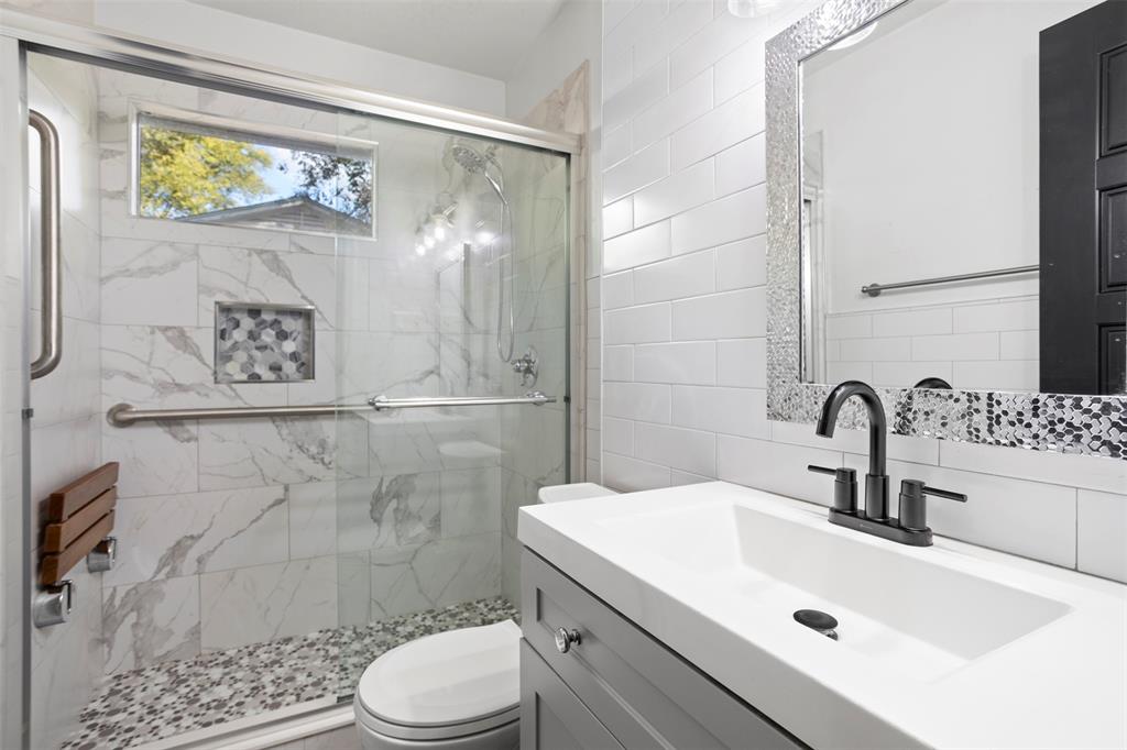 611 East Watkins Street Tyler, TX 75701 - Photo 19 of 29 a bathroom with a sink and a shower