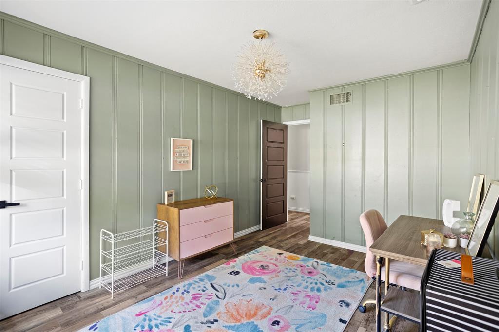 611 East Watkins Street Tyler, TX 75701 - Photo 23 of 29 a bedroom with a bed and wooden floor