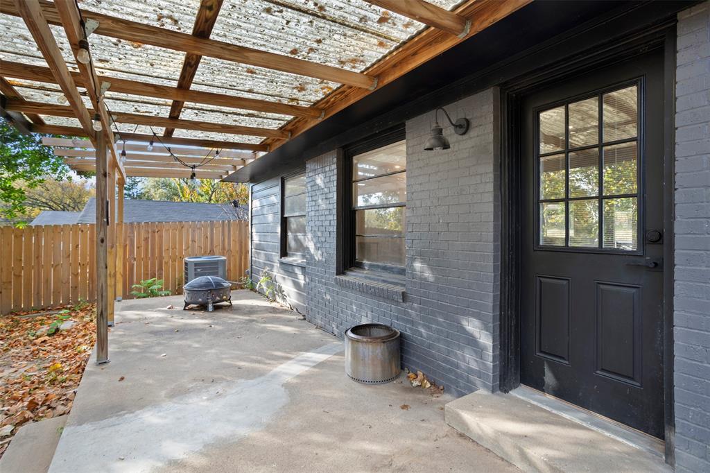611 East Watkins Street Tyler, TX 75701 - Photo 26 of 29 a backyard of a house with table and chairs