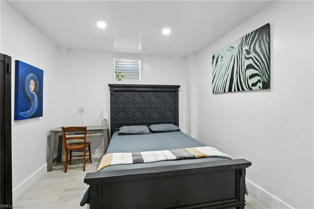 a kitchen with stainless steel appliances a refrigerator and a dining table