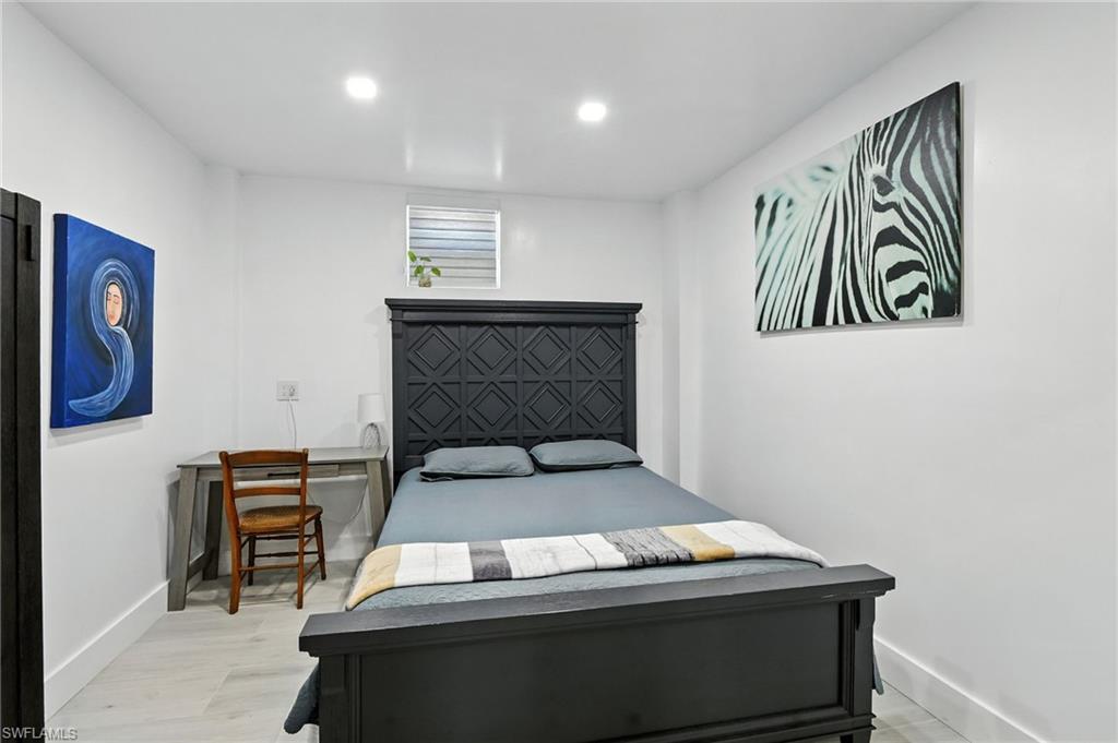 936 Panther Creek Lane Everglades City, FL 34139 - Photo 12 of 50 a bedroom with a bed and furniture