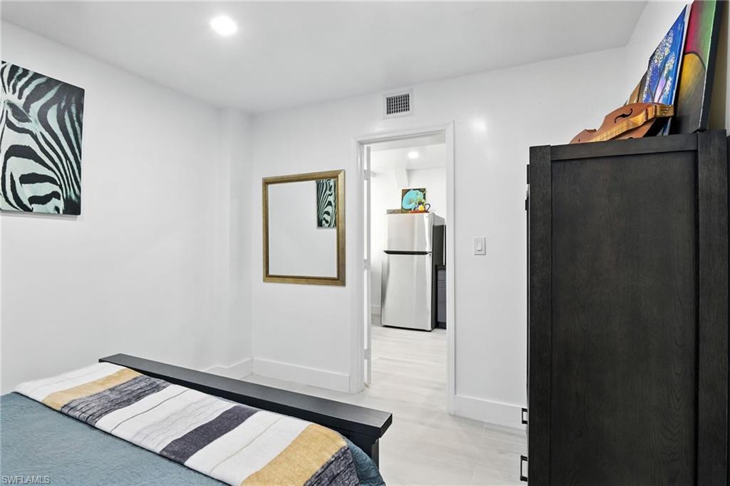 936 Panther Creek Lane Everglades City, FL 34139 - Photo 13 of 50 a view of a hallway with paintings on the wall