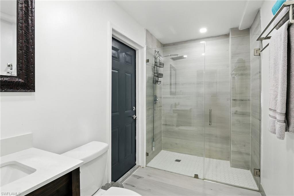 936 Panther Creek Lane Everglades City, FL 34139 - Photo 14 of 50 a bathroom with a shower and a sink